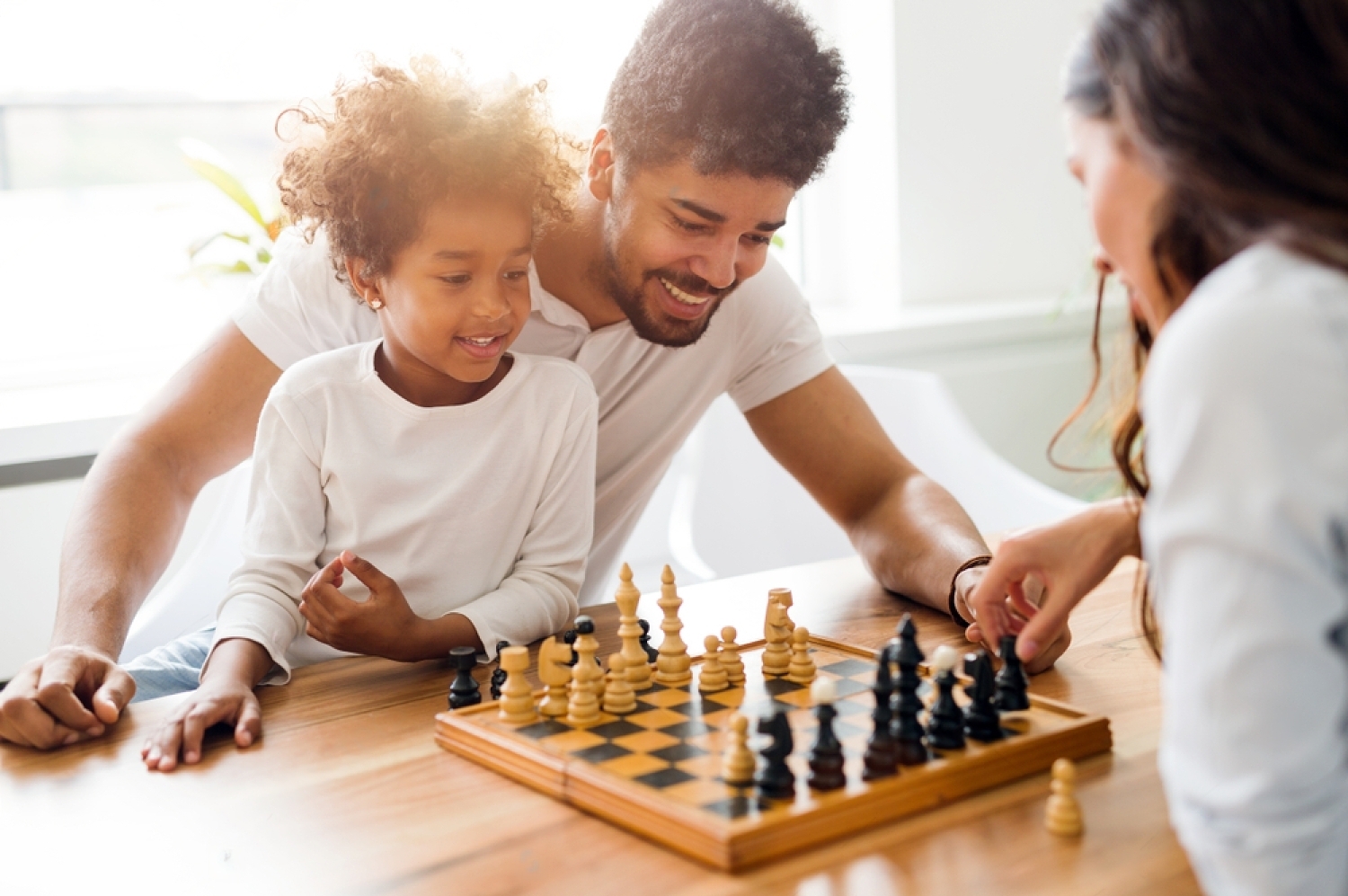 stock-photo-happy-family-playing-chess-together-788454118-iFOm6iwPu-transformed (2)